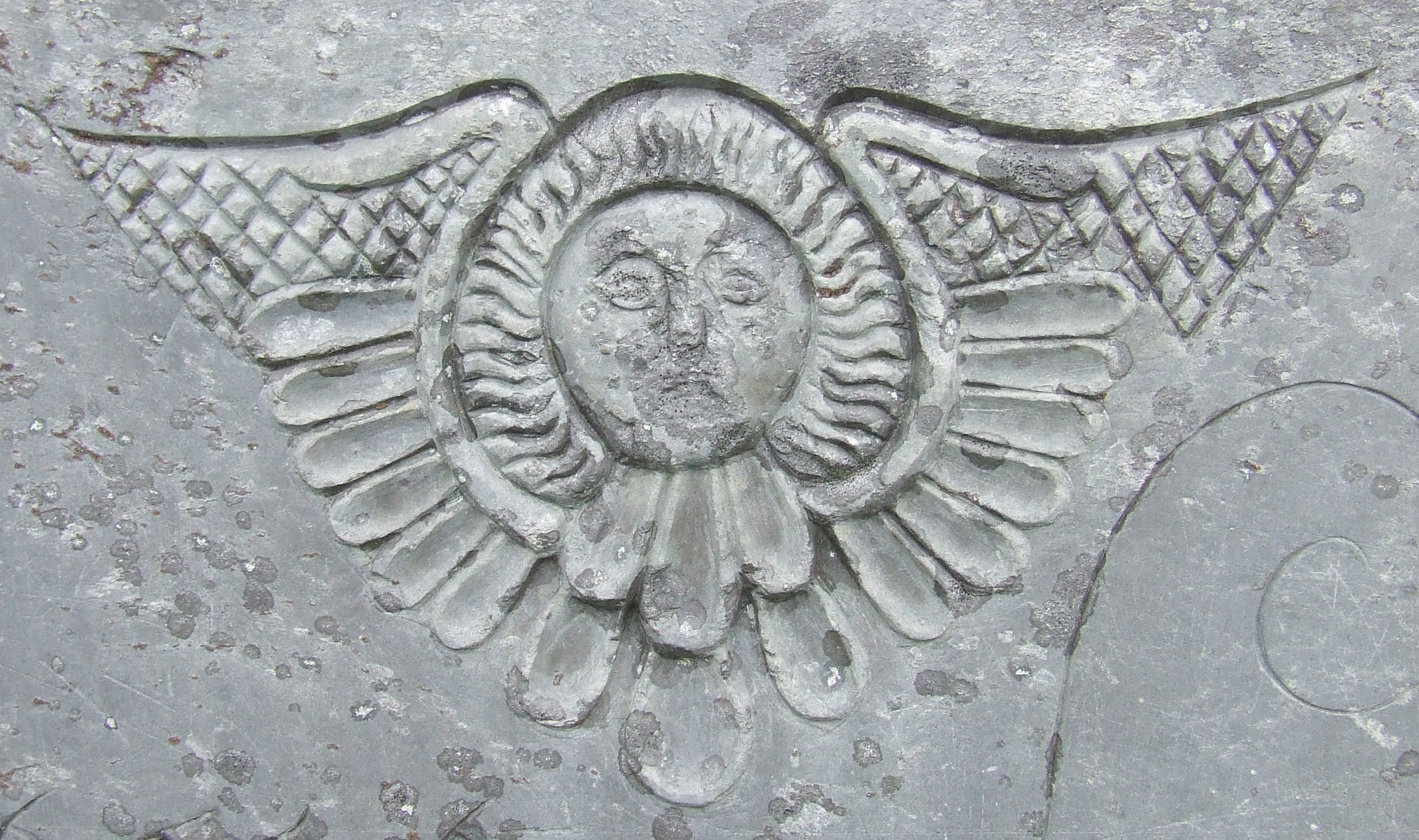 Carving of a cherub on a gravestone