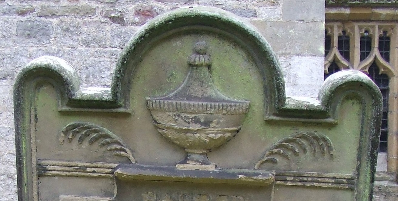 Carving of an urn on a gravestone