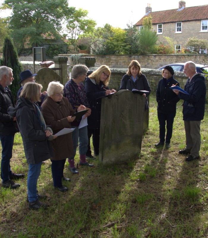 The Slingsby group receive tuition on how to record gravestones